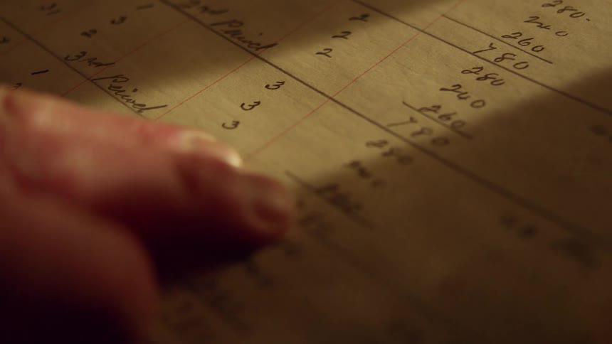 A view of someone looking at numbers on a piece of paper