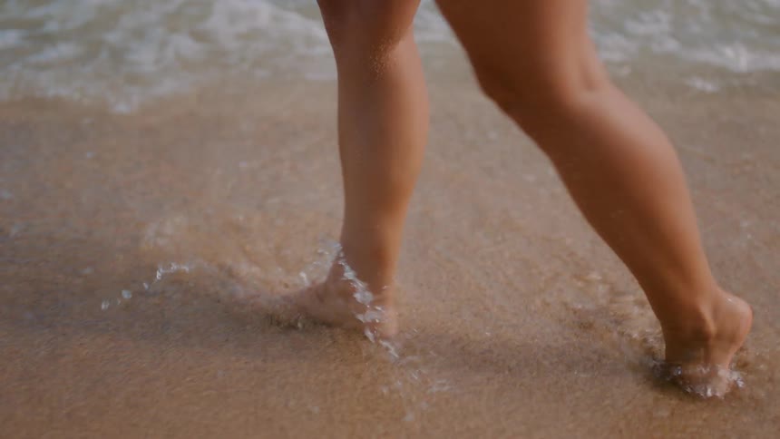 A person walking through the ocean