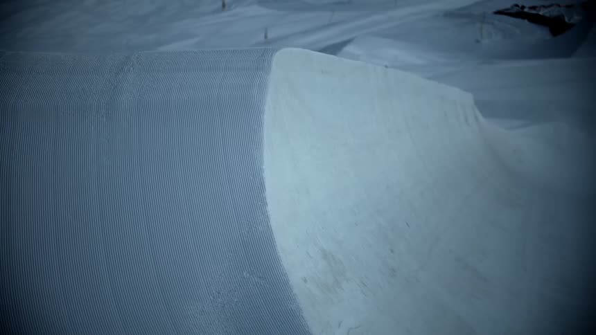 A thick blanket of undisturbed snow covers a mountain
