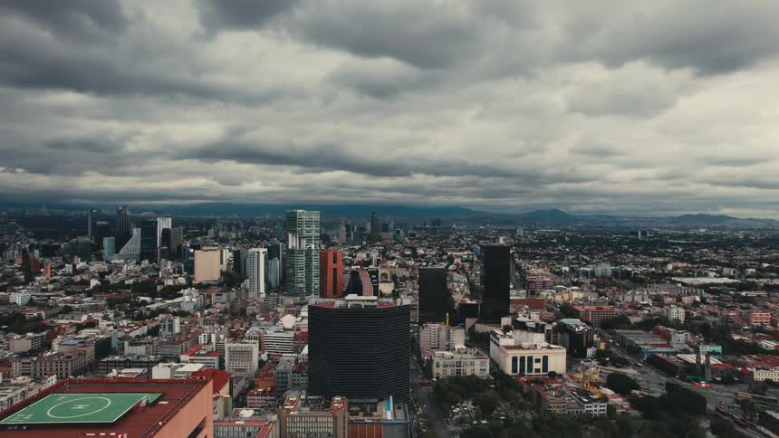 Big city with tall buildings and skyscrapers under a cloudy sky