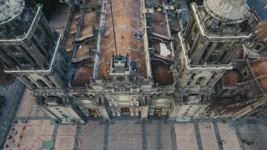 An aerial view of an old church in a city