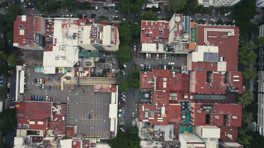 Buildings occupy parking lots near buildings