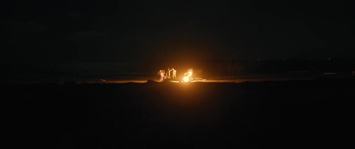 People dancing around fire