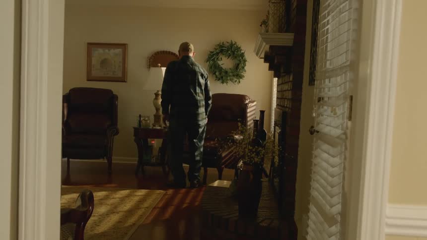 Elderly man sitting down