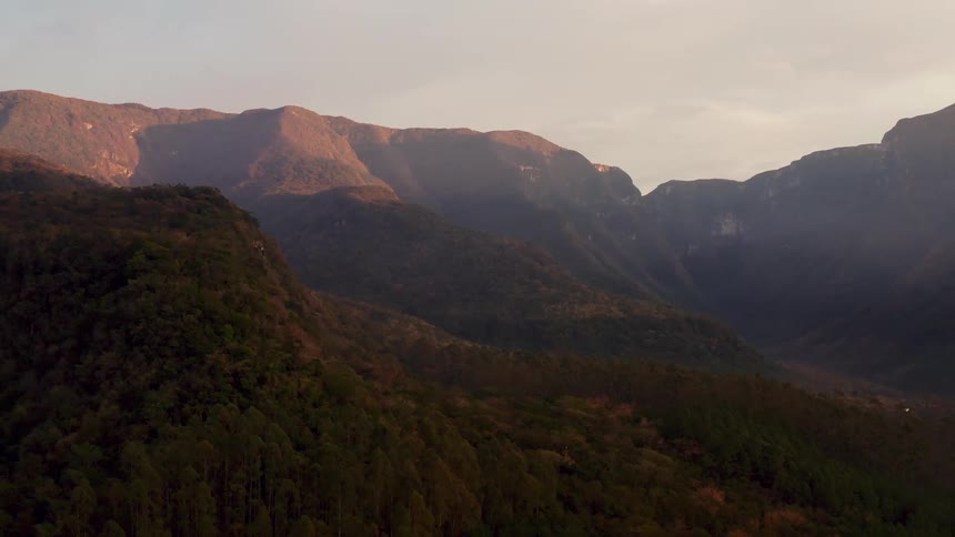 Morning sunlight is shining on mountain tops in the wilderness