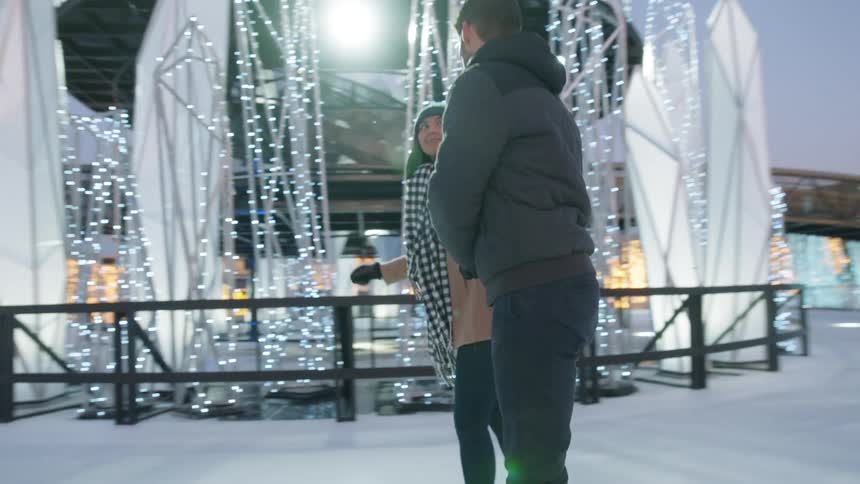 Couple date at ice skating park
