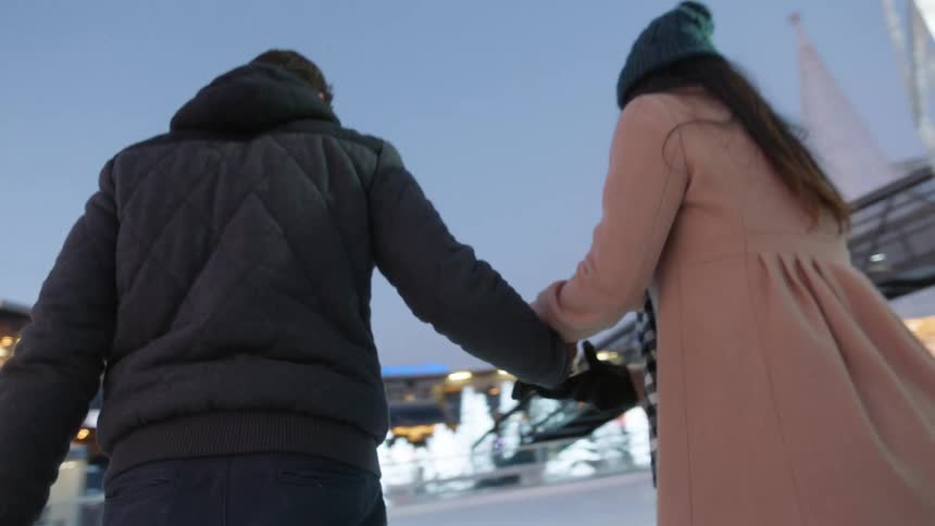Couple playing ice skating on the winter