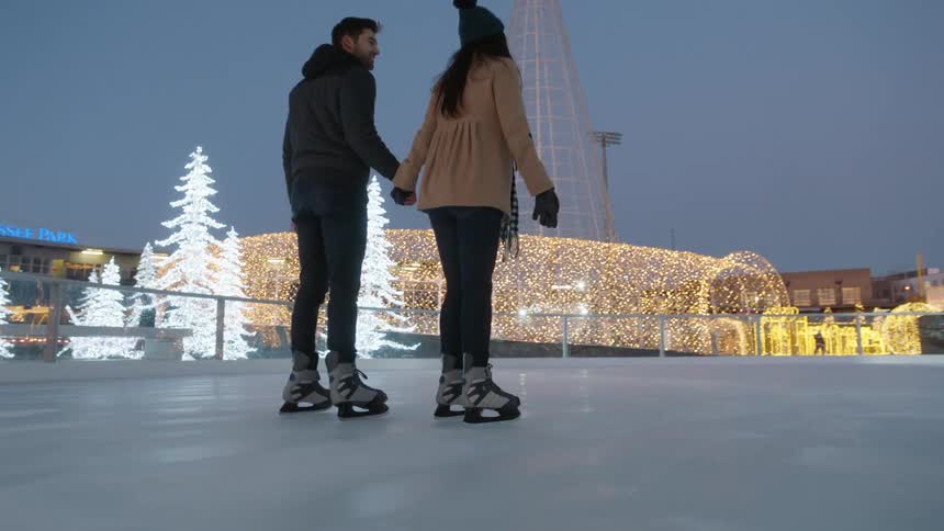 A couple ice skates