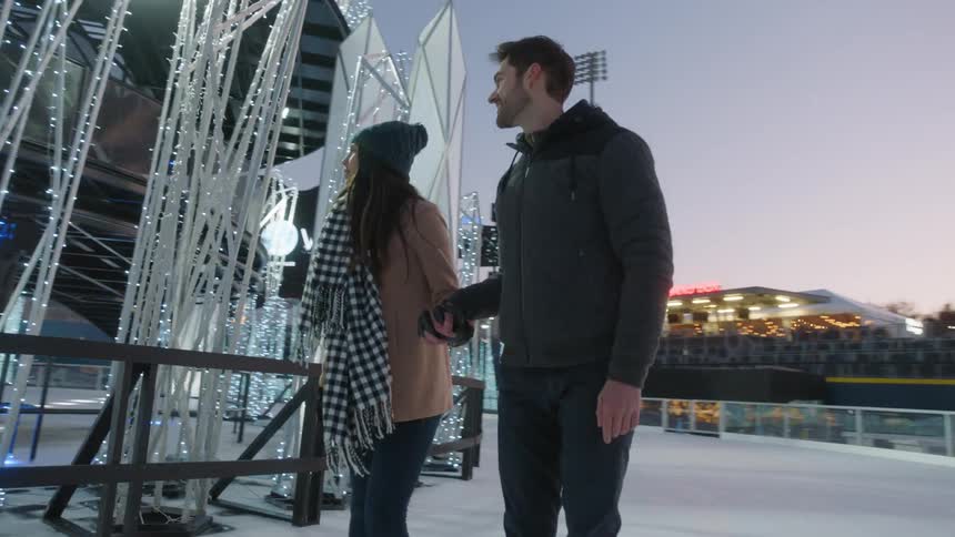 Couple playing ice skating at winter