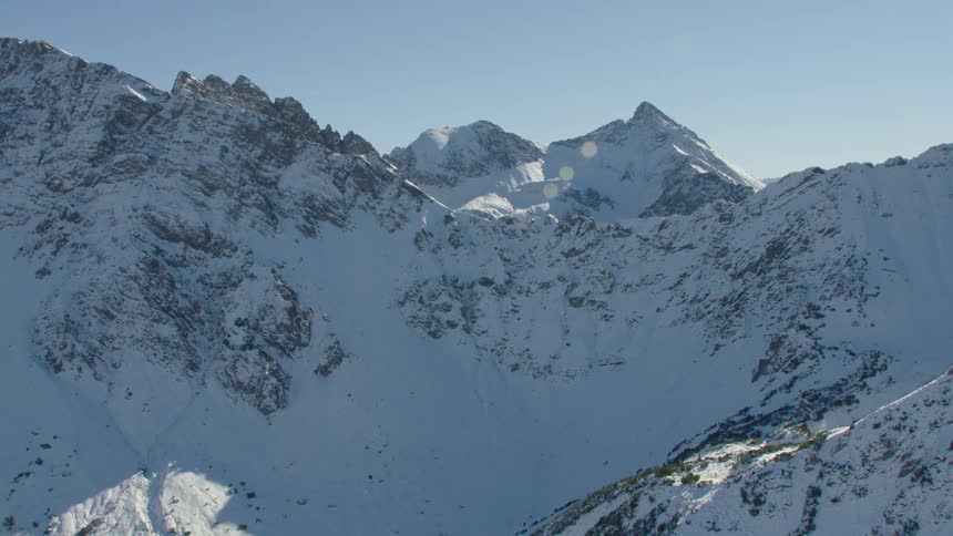 The mountains are covered in heavy snow