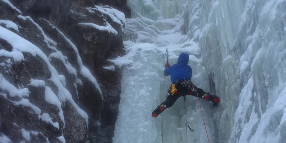 A man climbs a glacier