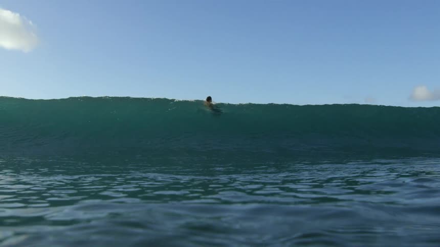 wave crashes into camera lens