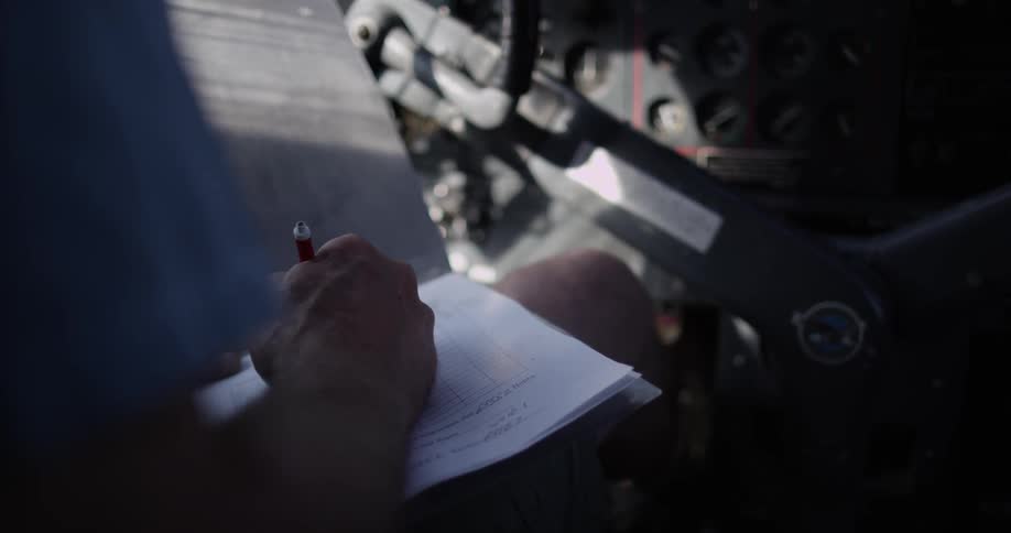 A man is writing a letter