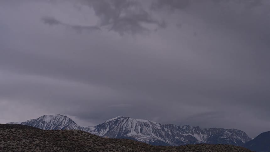 A time lapse of a mountain with snow on it