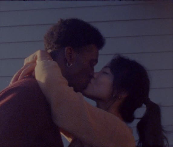 Interracial couple kissing