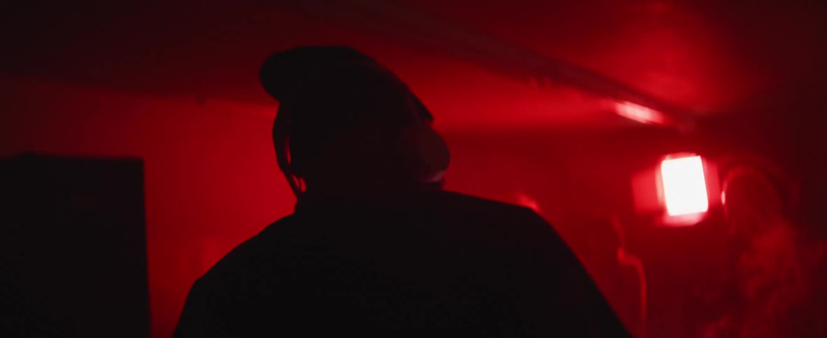 Music is being played for a party in a dark room