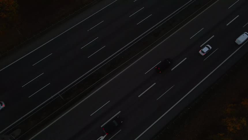 Traffic travels along either direction of a large freeway