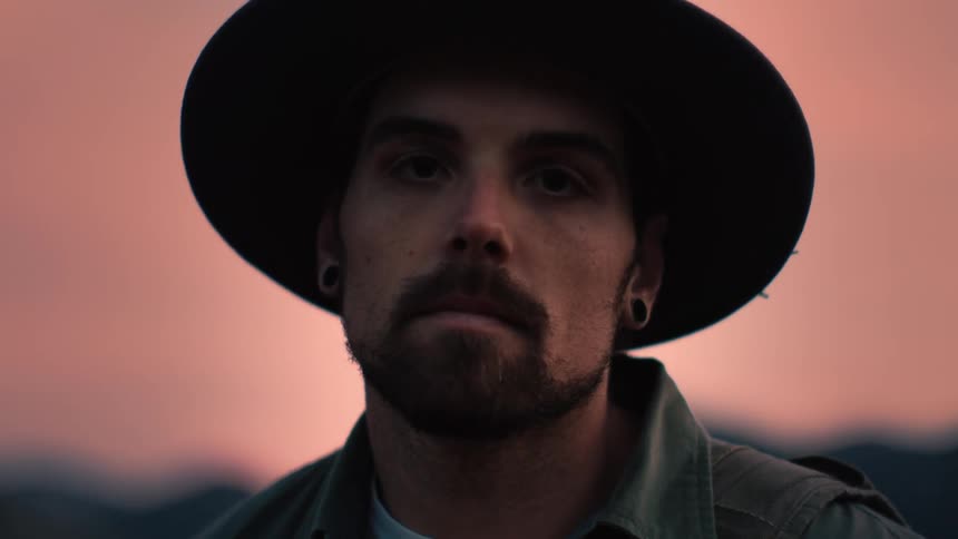 A portrait of a man standing outdoors