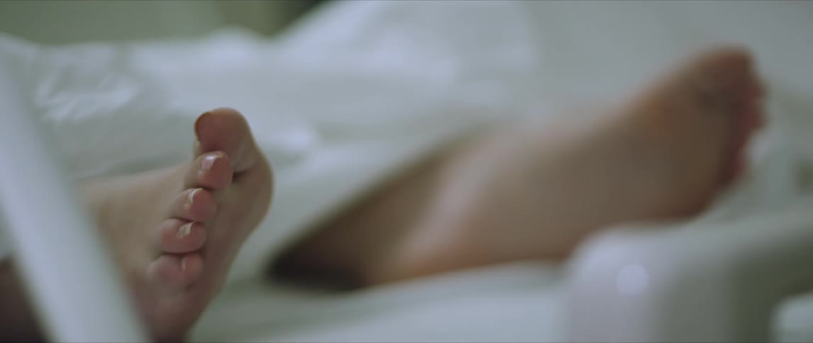 A person is laying in bed