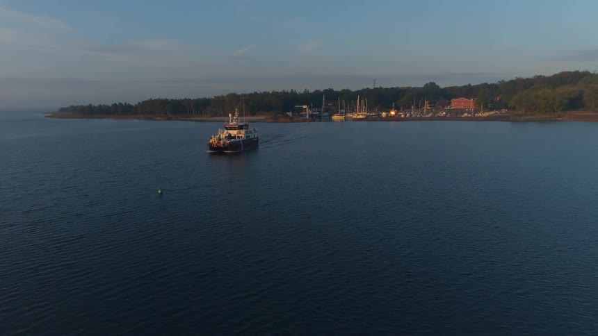 A boat is sailing into a harbor