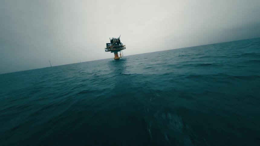 Aerial view of offshore wind turbines in wind farm