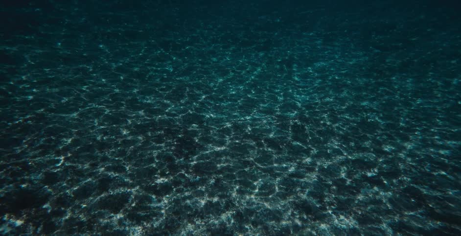 Sunlight reflecting on the ocean bottom causing light ripples