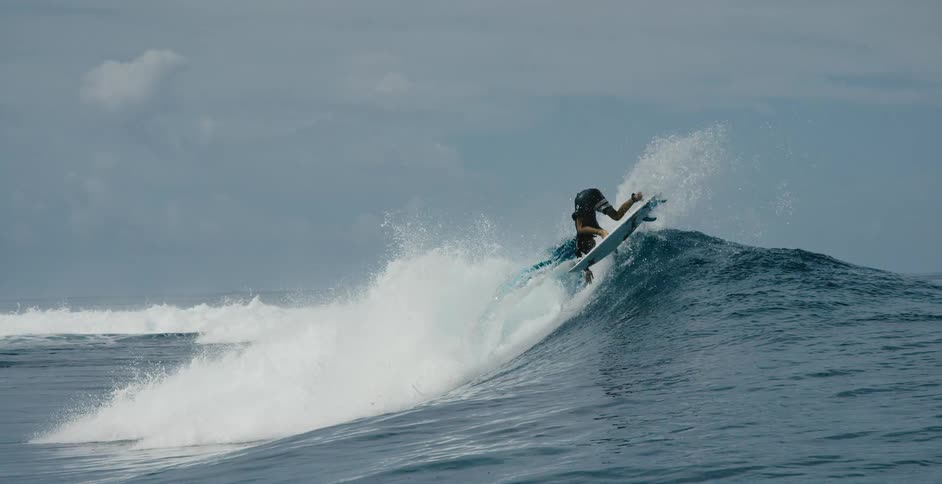 A view of a person surfing on a wave