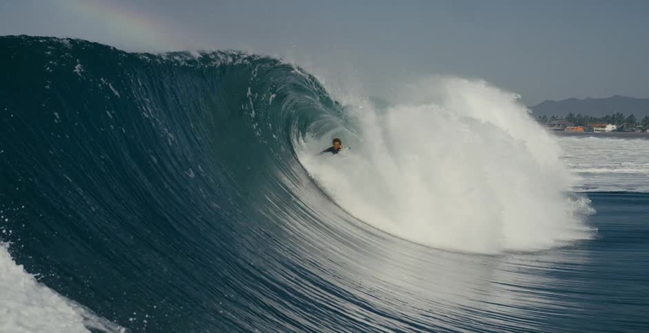 surfer wipe out in big barrel