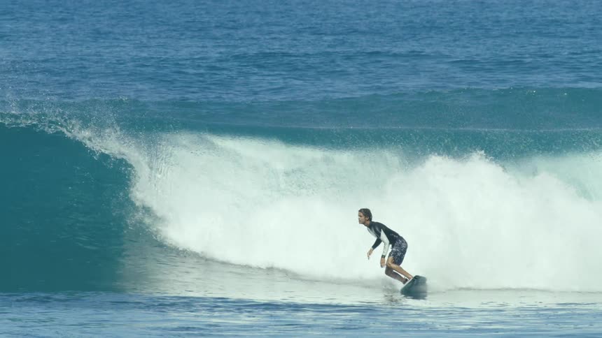 Three men surfing in the ocean