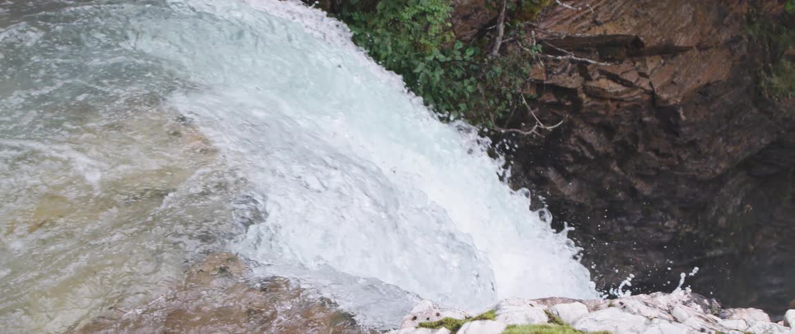 Aerial view of waterfalls as water goes over the edge