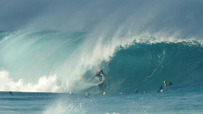 Surfer surfing wave