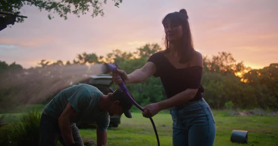 Two people working on a yard together