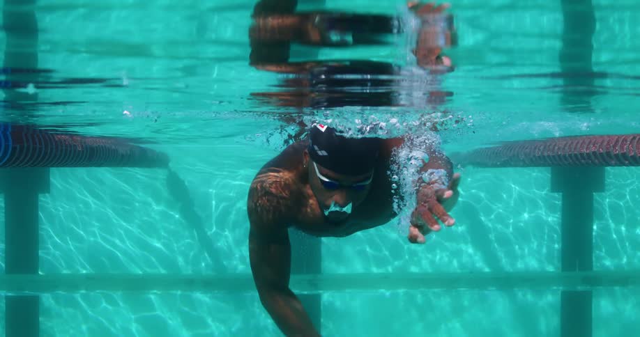 A man swims underwater