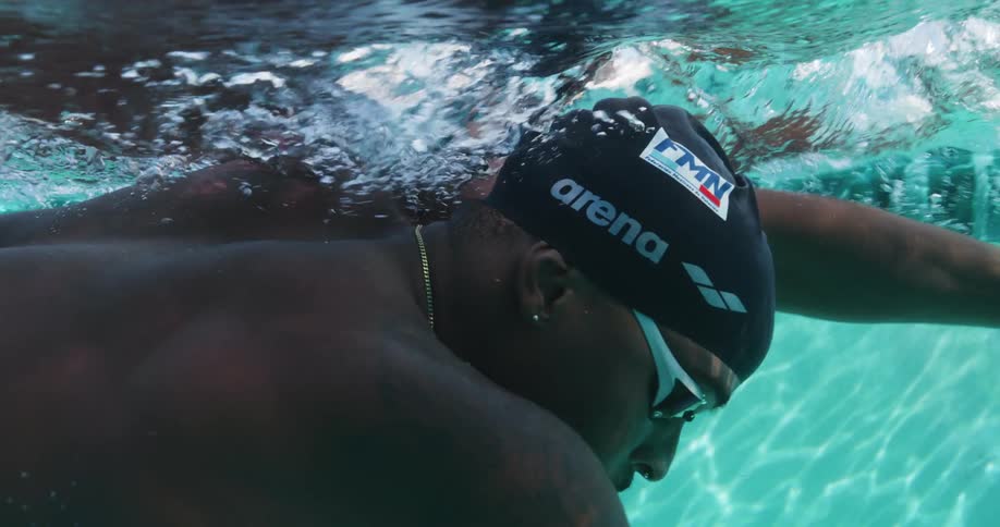 A man swims laps in a pool