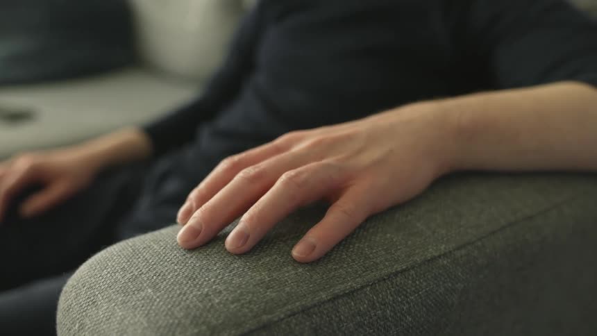 Person is sitting on a chair during the day