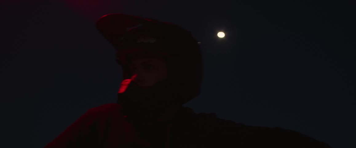 A person is traveling using a crash helmet