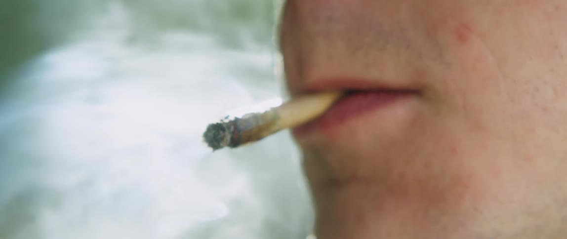 Close up of man smoking cigarette