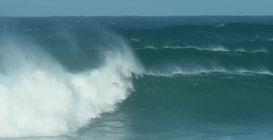 Ocean waves move across the surface of the ocean