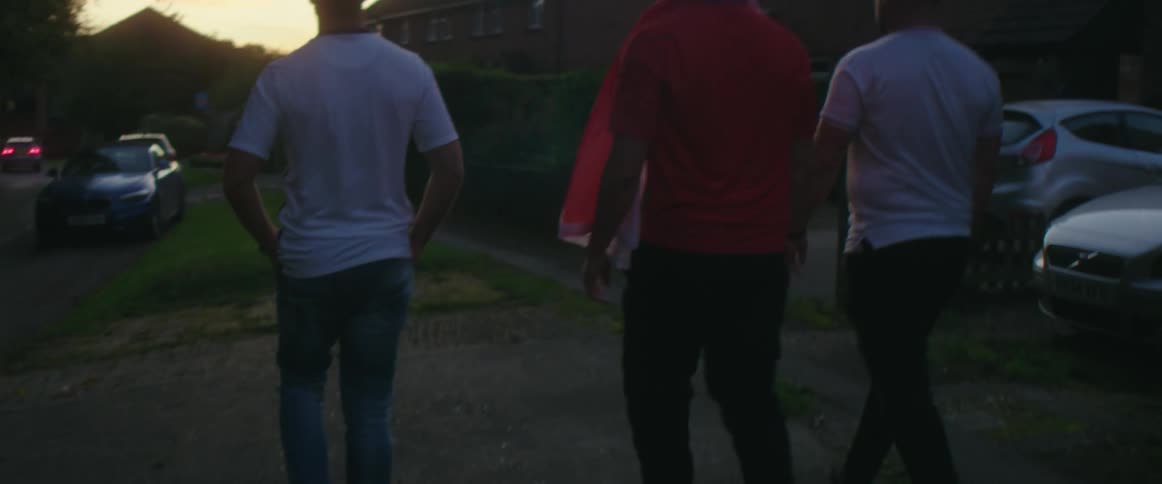 A group of people walking with a dog