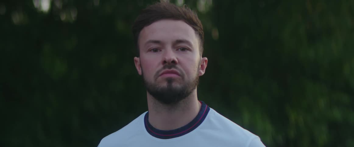 A man is staring forward looking angry
