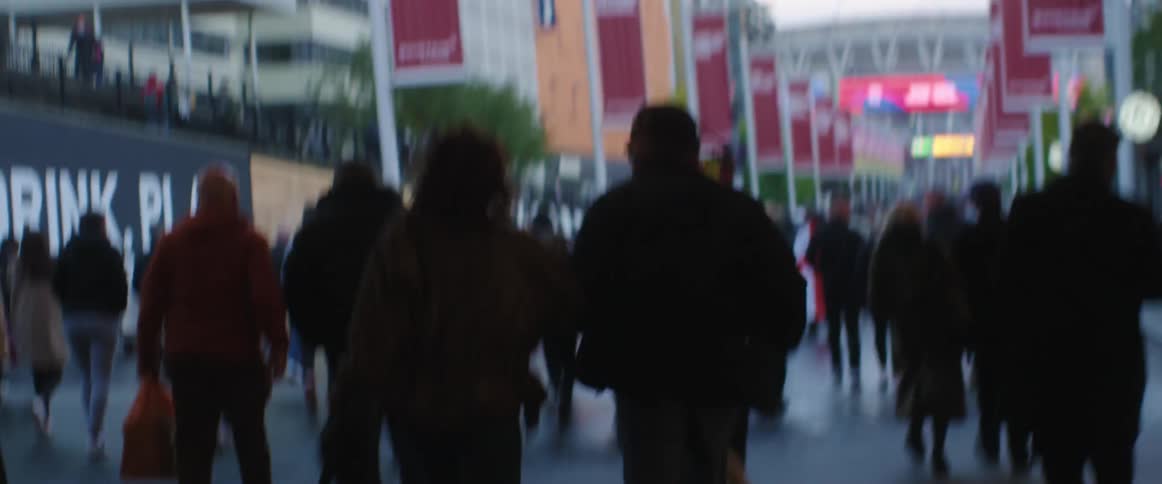 People are walking through a downtown city in spring