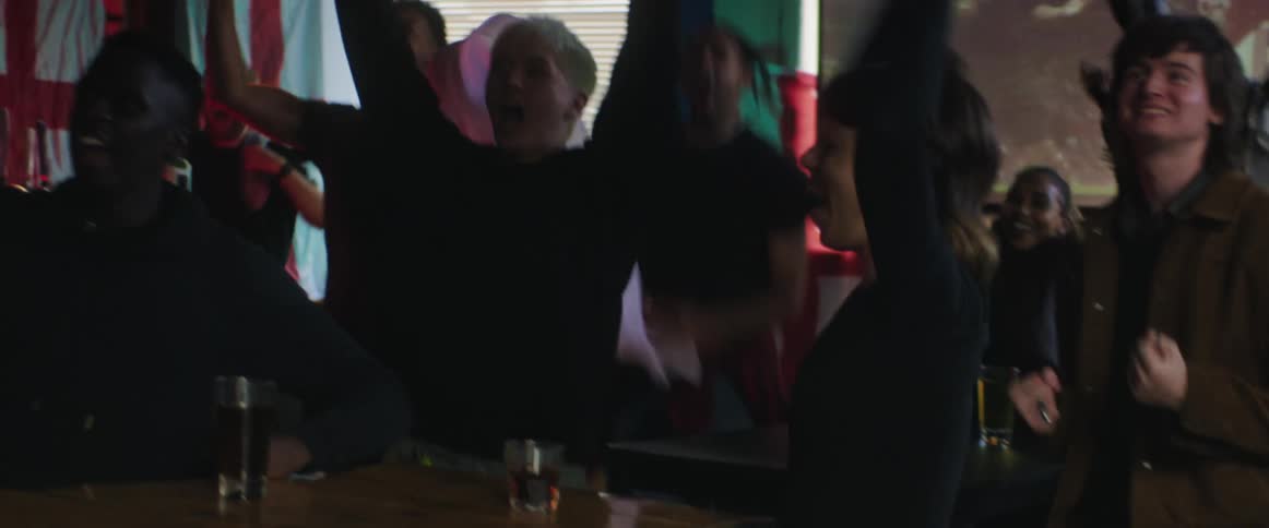 People watching football in a pub