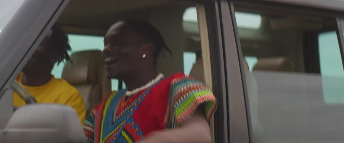 Two men sing while they are driving