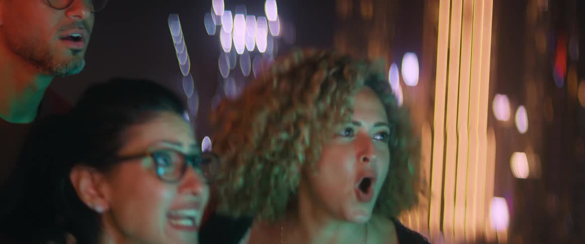 A group of friends are cheering together and celebrating
