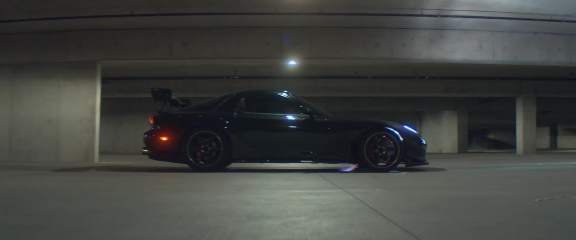 Flares should out from under and behind a car in a parking garage
