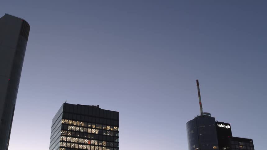 The sun is setting on the skyscrapers