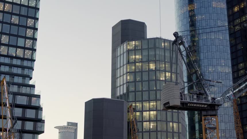 Construction equipment is in a downtown city