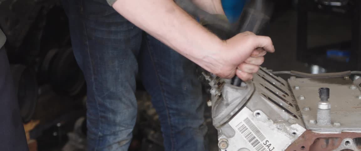 People taking apart machine