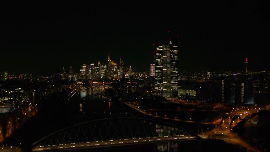 Big city towers and skyscrapers and the skyline lit up at night