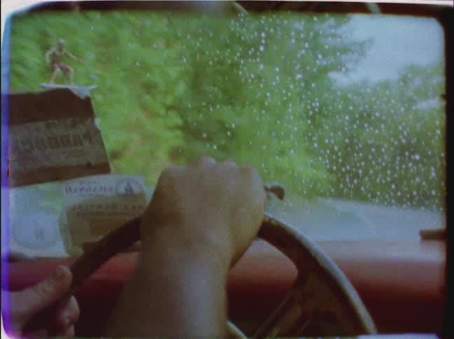 Close up of hands driving a car